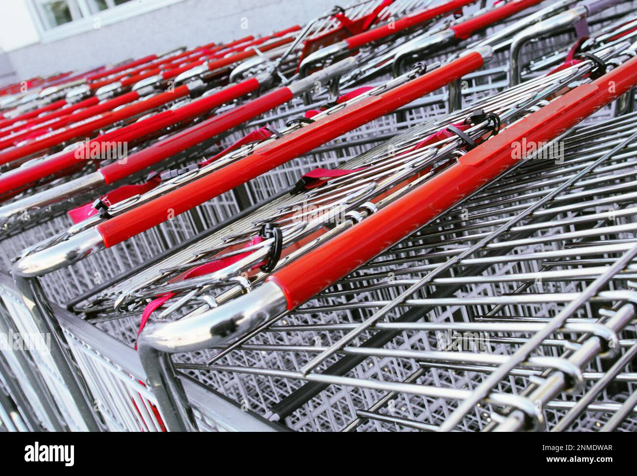 Supermarket shopping carts stacked. Empty grocery shopping trolleys lined up Stock Photo