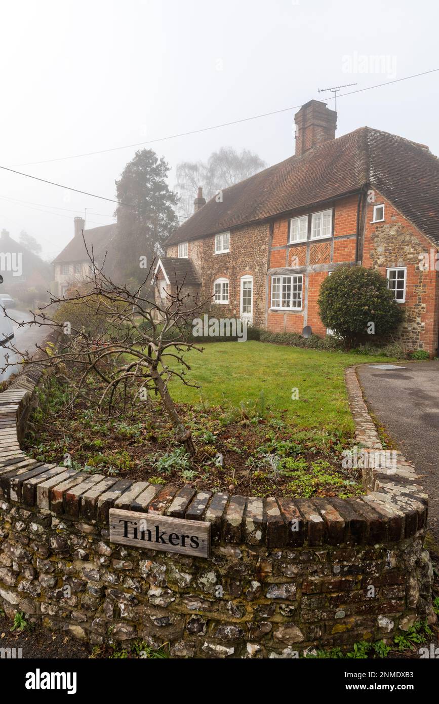 Traditional cottages in the village of Graffham at the base of the South Downs on a foggy winter morning, West sussex, England, Uk Stock Photo