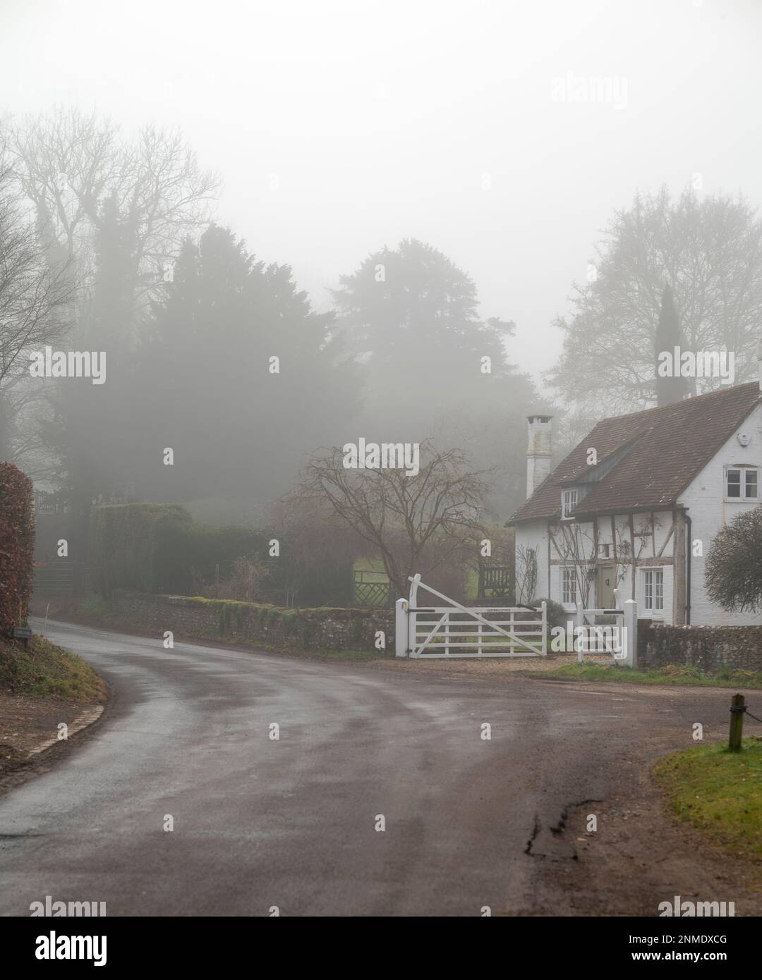 A foggy winter morning in the village of Graffham at the foot of the South Downs, West Sussex, England, UK Stock Photo