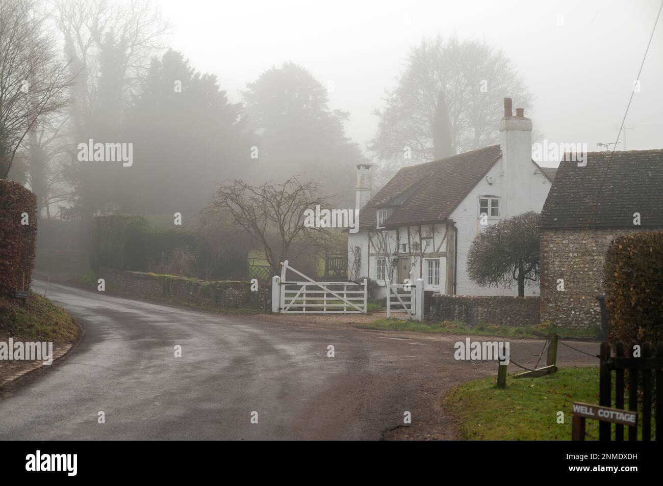 A foggy winter morning at the foot of the South Downs in the village of Graffham in West Sussex, England, UK Stock Photo