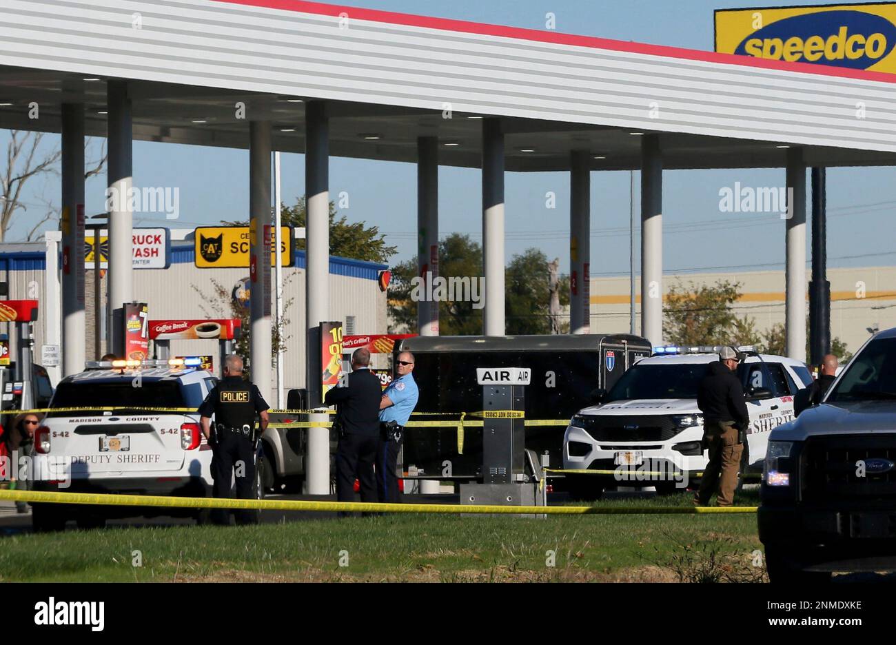 ADDS THAT POLICE OFFICER HAS DIED Police investigate the scene of a