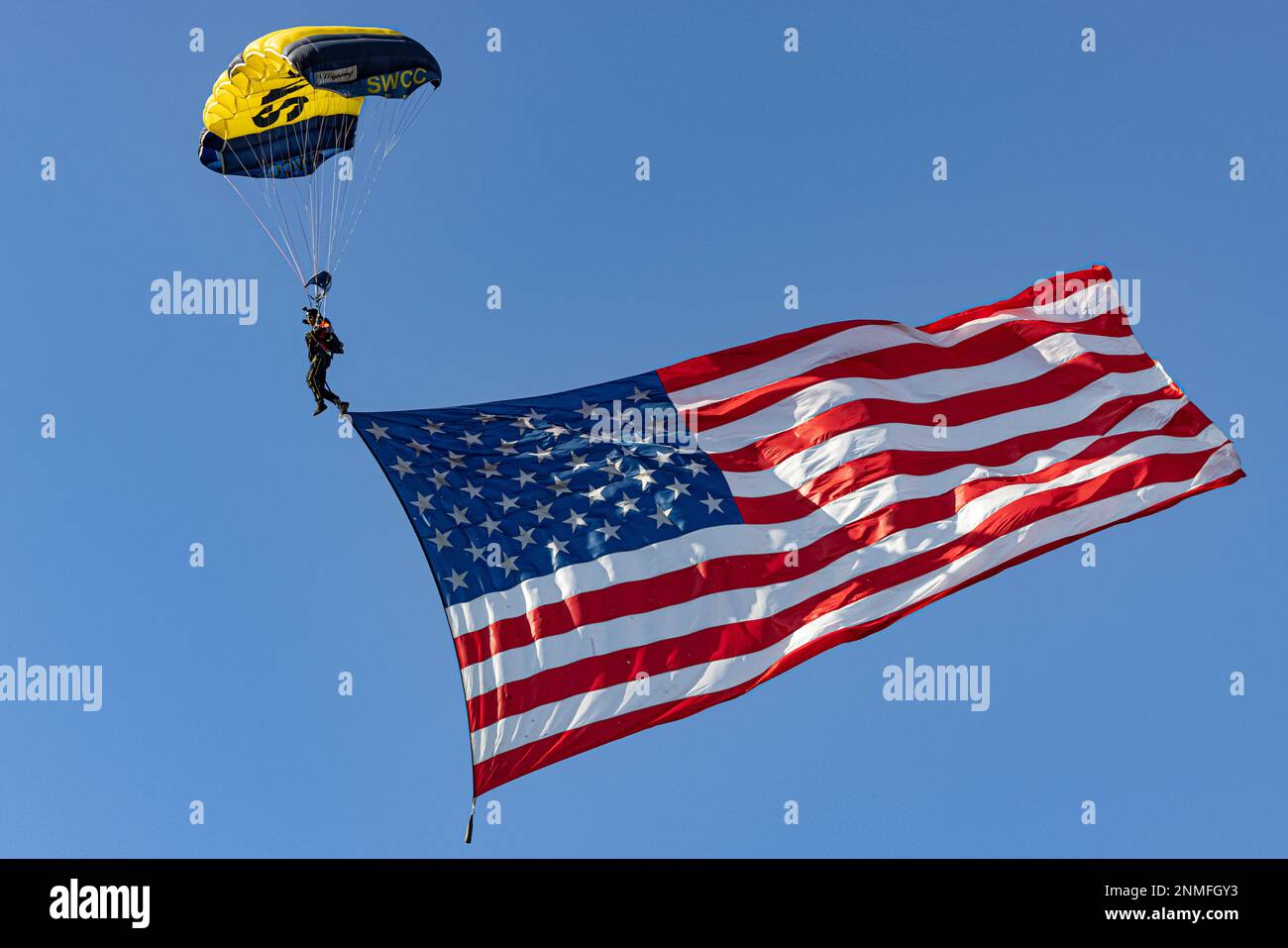 A member of the U.S. Navy Leap Frogs parachute team participates in a jump during the season opening ceremony for the San Diego Legion at Snapdragon Stadium, Feb. 18, 2023. The San Diego Legion is part of Major League Rugby, a professional sports league starting its sixth season. (U.S. Marine Corps photo by Lance Cpl. Alex Devereux) Stock Photo