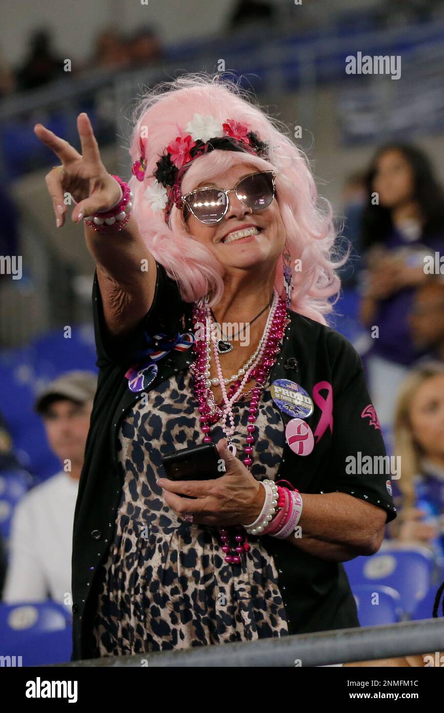 BALTIMORE, MD - OCTOBER 11: A Baltimore Ravens Fan wears a pink wig in  support of those affected by cancer during and NFL game between the  Indianapolis Colts and Baltimore Ravens on