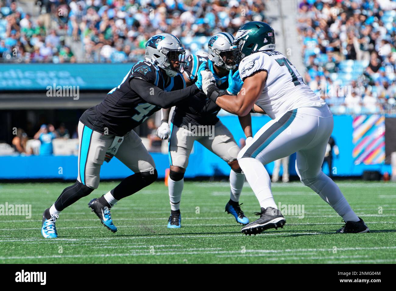 CHARLOTTE, NC - OCTOBER 10: Philadelphia Eagles offensive tackle Andre  Dillard (77) blocks Carolina Panthers linebacker Jermaine Carter (4) during  the game between the Carolina Panthers and the Philadelphia Eagles on  October