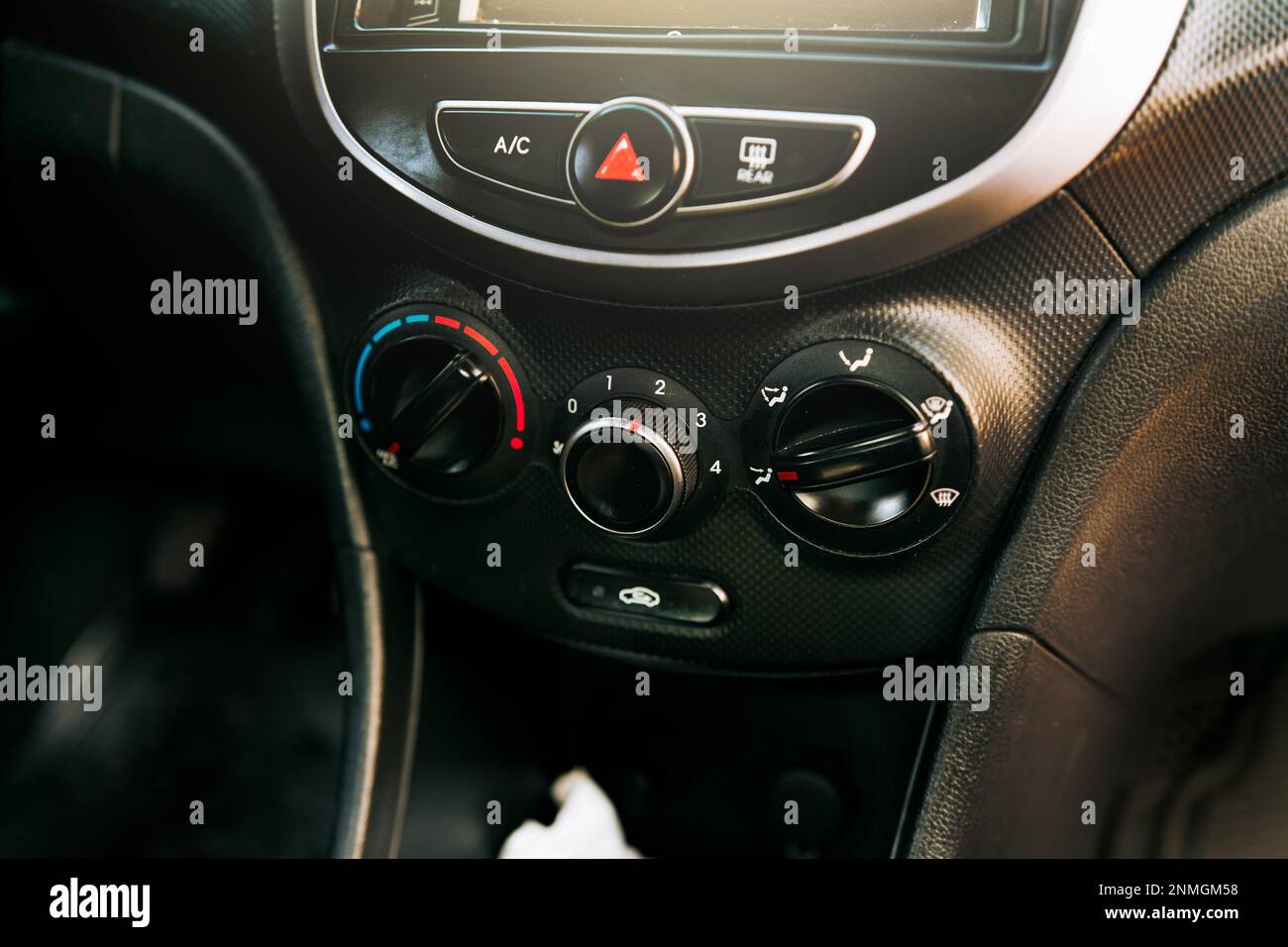 Front view of a car air conditioning control panel. Close up of