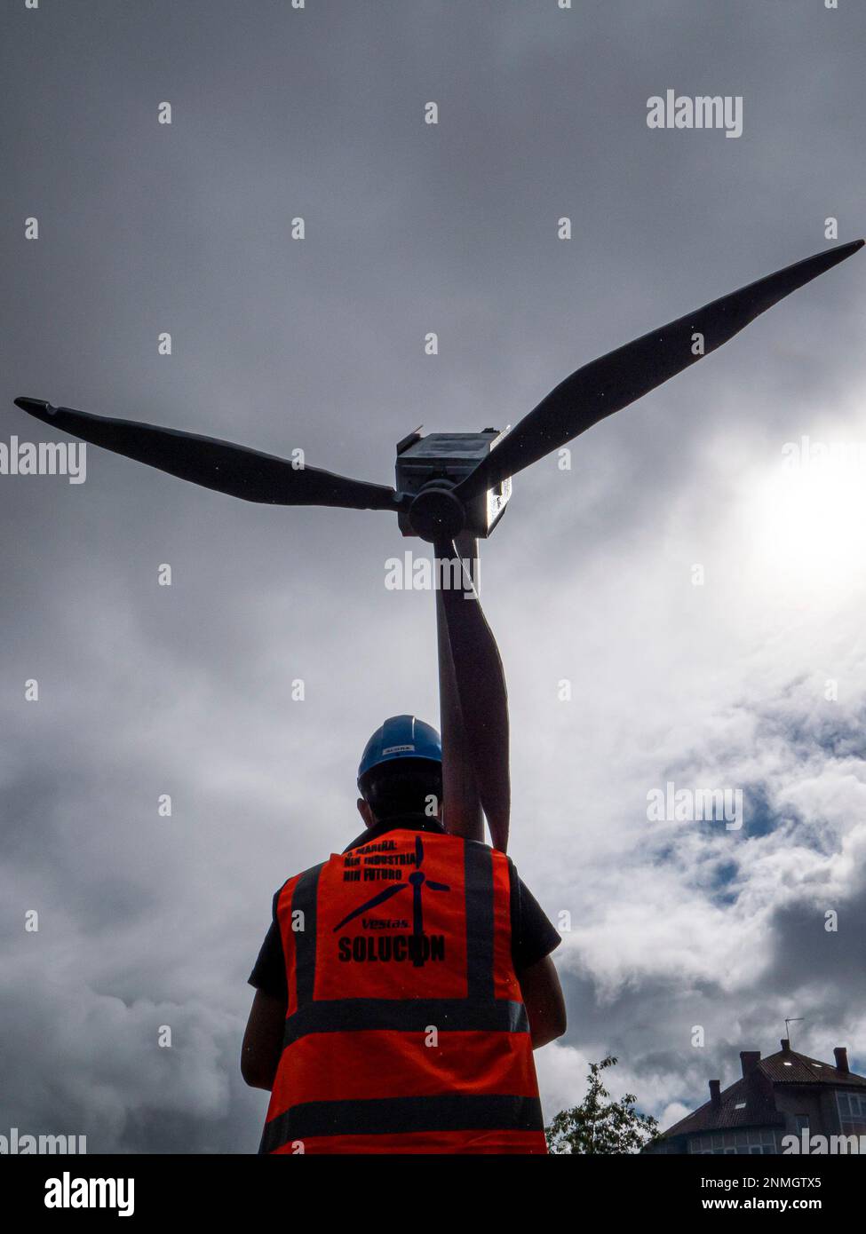 A Vestas worker carries a windmill in a march against the closure of the  factory in Viveiro (Lugo) that would affect 115 people, on October 5, 2021,  in Santiago de Compostela, Galicia, (