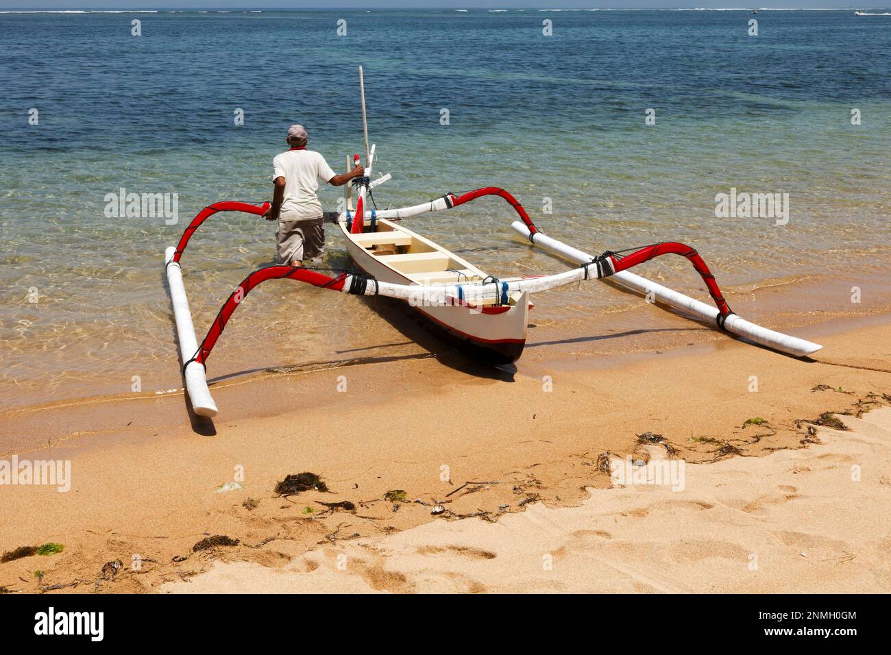 Fishing outriggers on the beach of Sanur, Bali, Indonesia Stock Photo -  Alamy