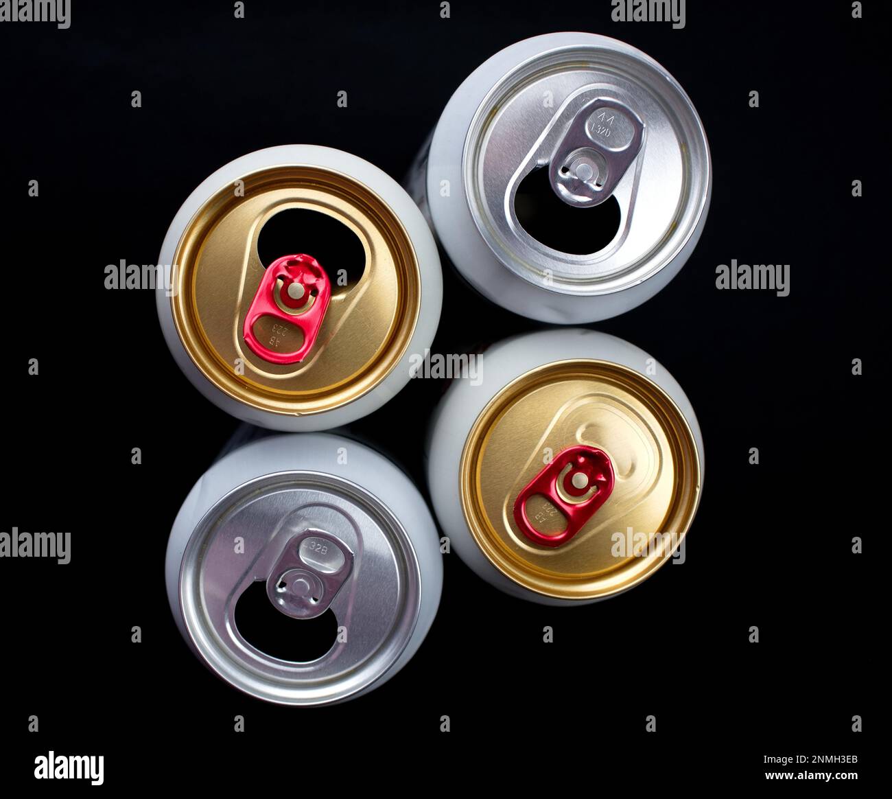 Three Opened And One Unopened Beer Cans Stock Photo Alamy