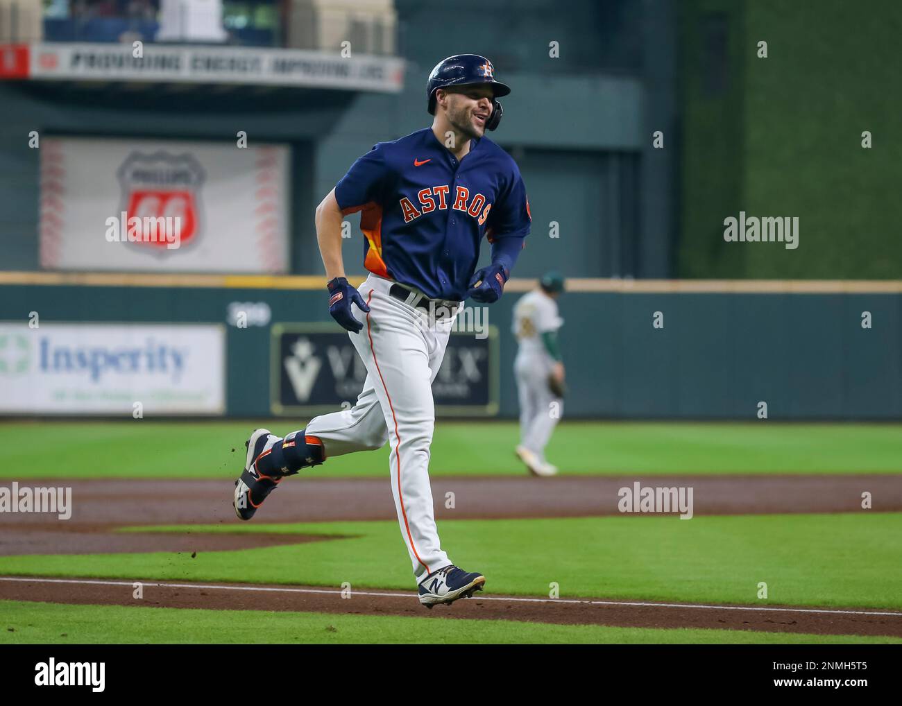 Houston Astros' Chas McCormick runs to first base after hitting a