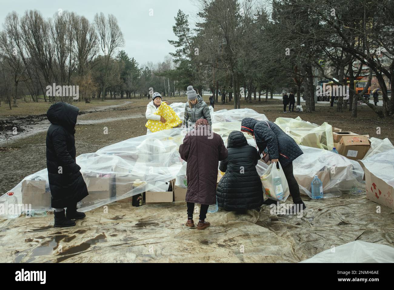 Residents of the house destroyed by a Russian missile attack that killed 45 people receive relief goods from neighbourhood donations, Dnipro Stock Photo