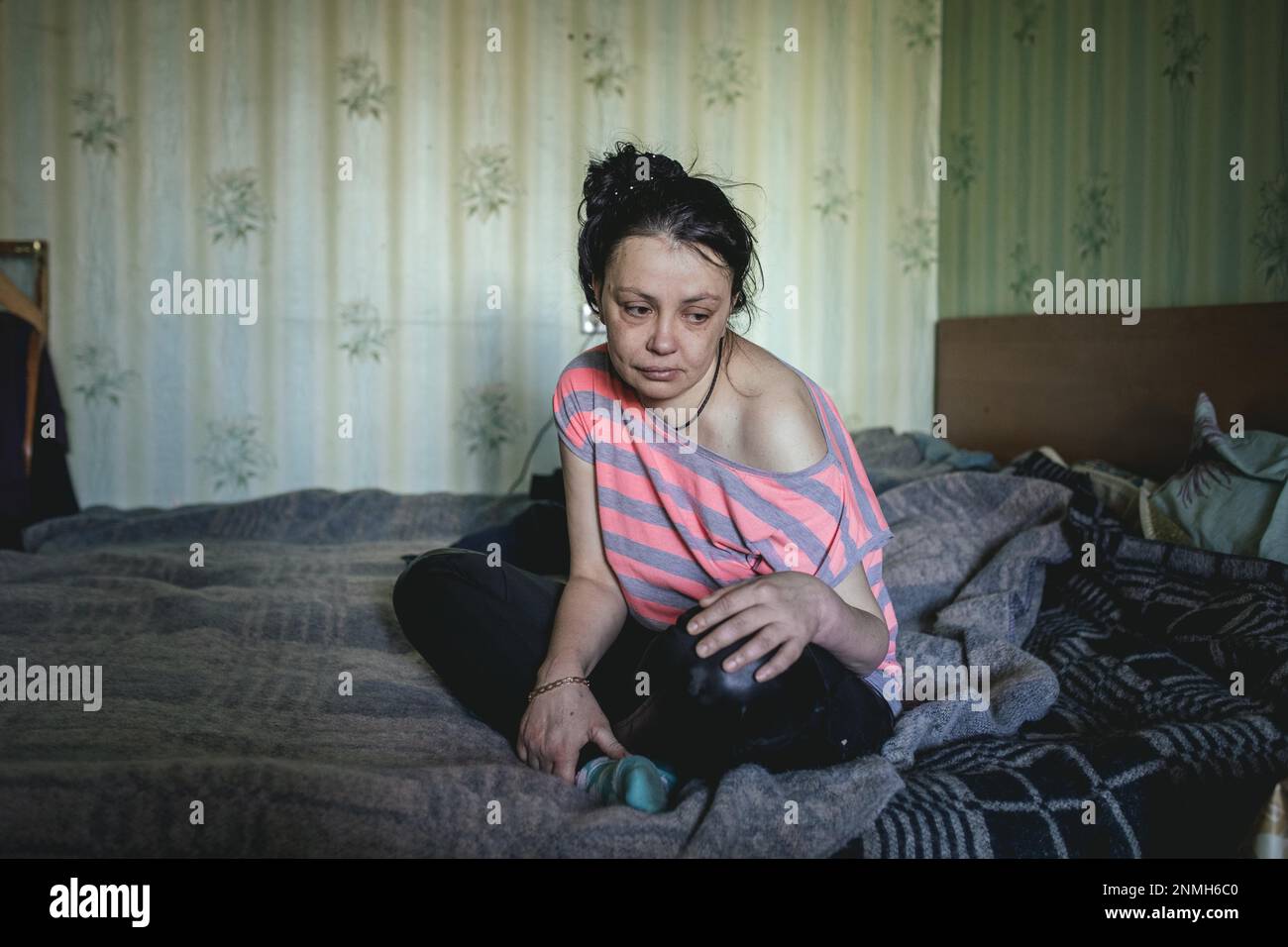 Iulia, 36 years old, she is unemployed and lives with her parents and her bedridden grandmother in one room in a flat in Kherson, the apartment Stock Photo