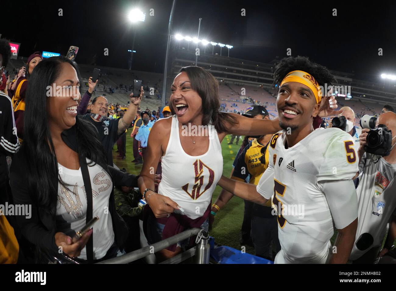 Regina Jackson (center) celebrates with her son, Arizona State Sun