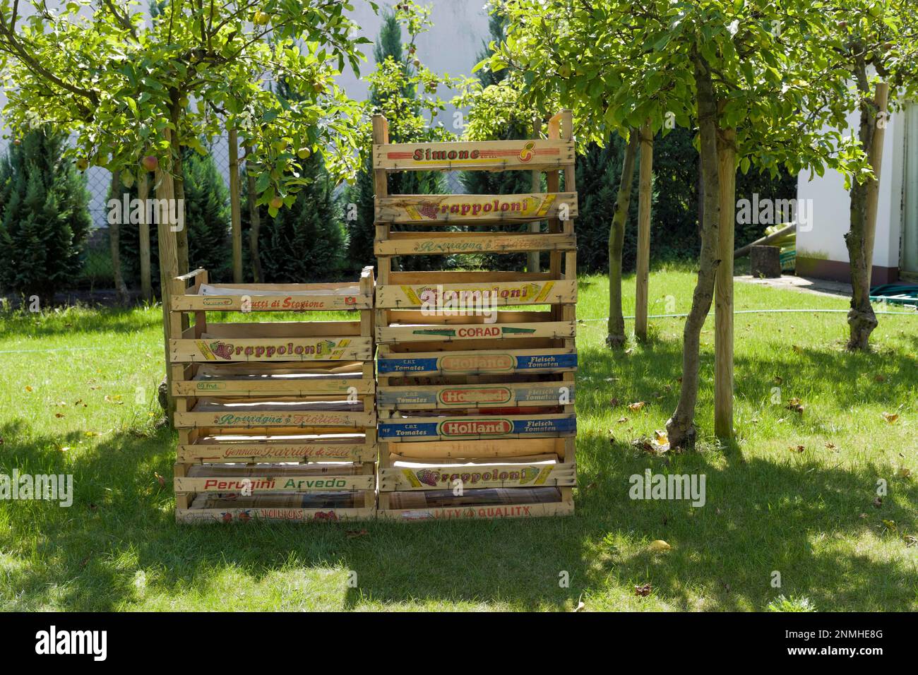 Stacked fruit and vegetable boxes in an orchard Stock Photo Alamy