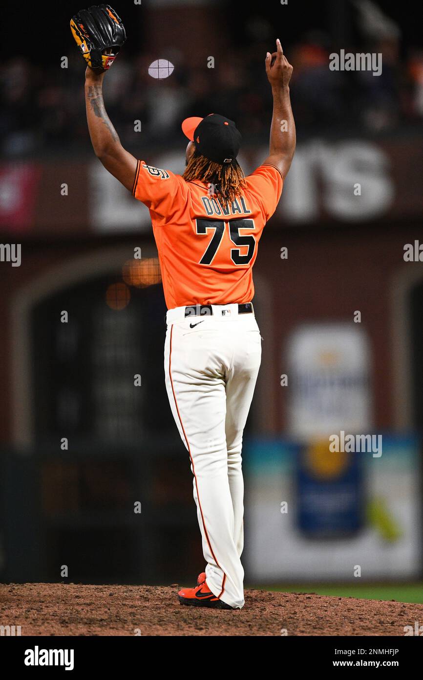 SAN FRANCISCO, CA - OCTOBER 01: San Francisco Giants pitcher Camilo Doval  (75) points to the sky after saving a MLB game between the San Diego Padres  and the San Francisco Giants