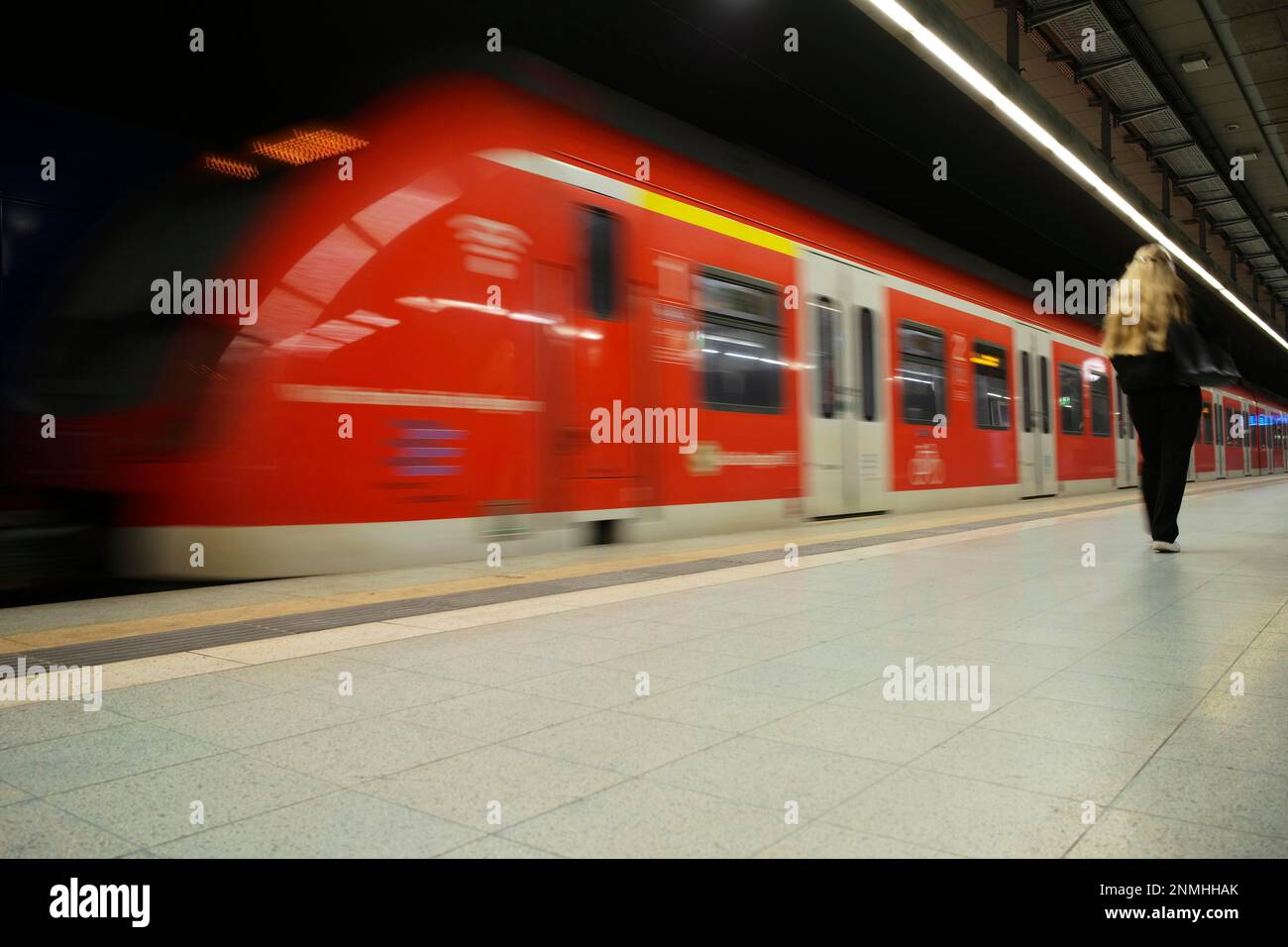 Arriving S-Bahn, class 420 in traffic red, Feuersee station, passengers, Stuttgart, Baden-Wuerttemberg, Germany Stock Photo