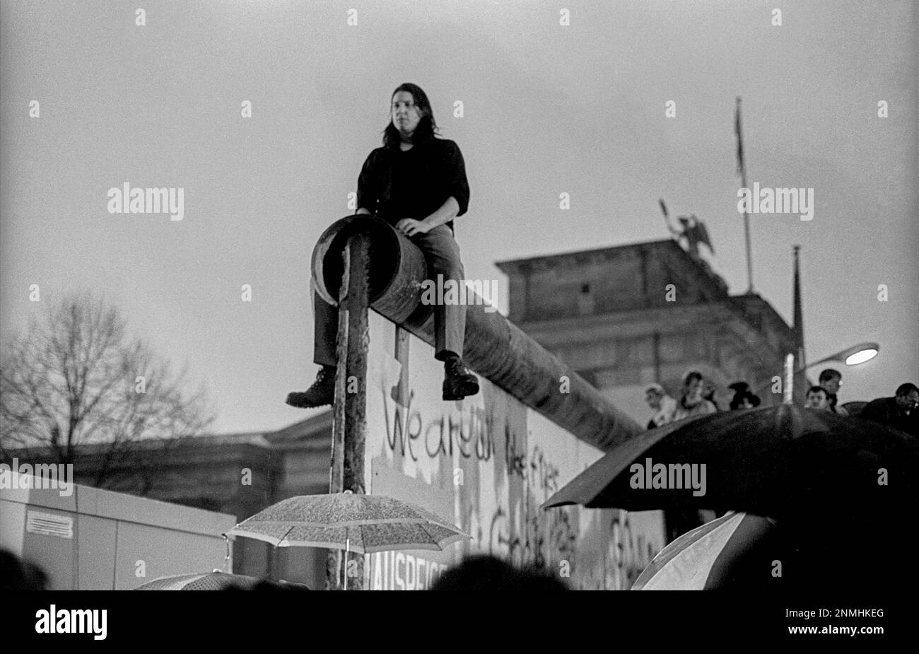 GDR, Berlin, 22.12.1989, opening of the Brandenburg Gate, the Wall is opened at the Brandenburg Gate, man on the Wall Stock Photo