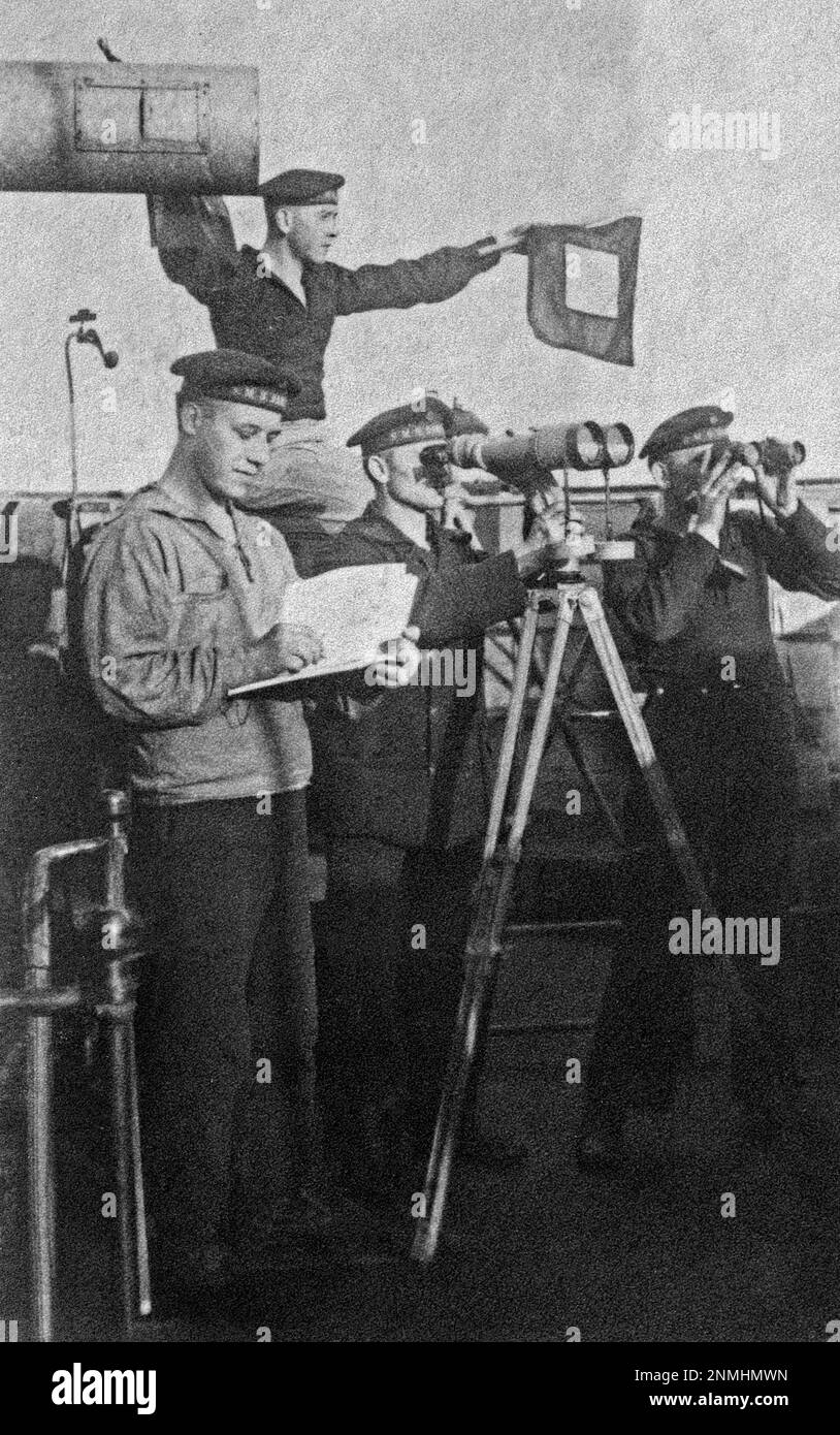 Sailors posing for a photo on their ship, gun, flag, binoculars, Germany, First World War, ca. 1915 Stock Photo