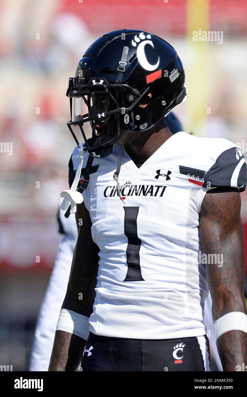 Cincinnati cornerback Ahmad Sauce Gardner holds up a jersey for