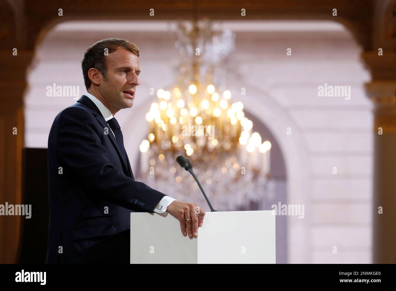 French President Emmanuel Macron delivers a speech during a meeting in memory of the Algerians who fought alongside French colonial forces in Algeria's war, known as Harkis, at the Elysee Palace in Paris, Thursday, Sept. 20, 2021. Macron's speech is the latest step in his efforts to reconcile France with its dark colonial past, especially in Algeria. (Gonzalo Fuentes/Pool Photo via AP) Stock Photo