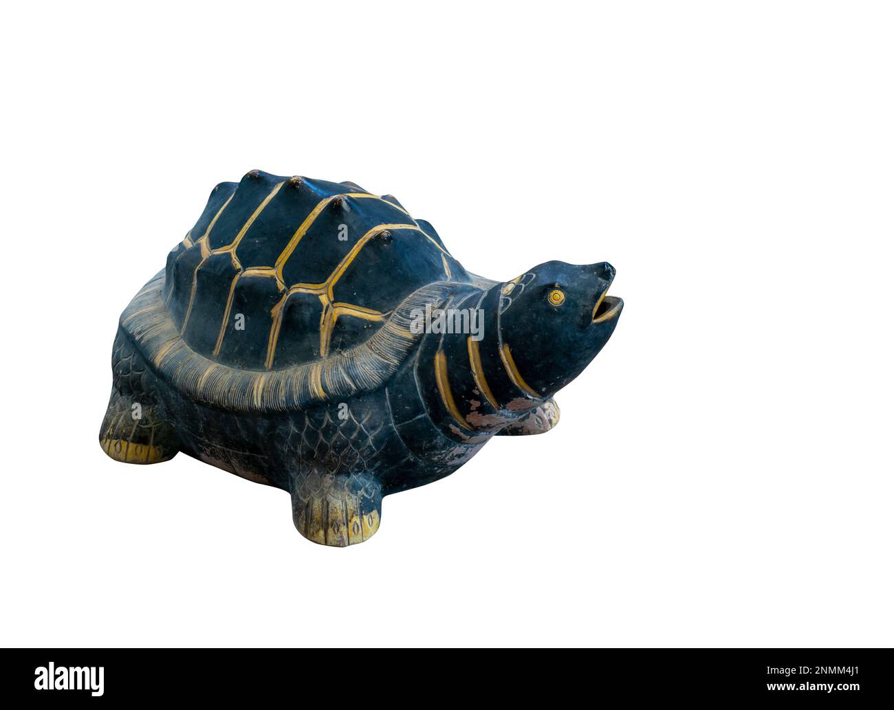A cute turtle made of clay for garden decoration, old condition from weather, painted with dark green color and gold for the line. Isolated image on w Stock Photo