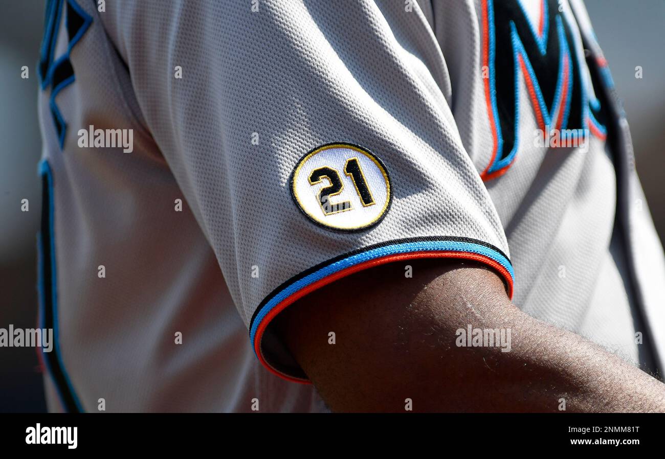 WASHINGTON, DC - SEPTEMBER 15: A close up of the yellow and black number 21  circular patch worn by the Miami Marlins players in honor of Roberto  Clemente Day during the Miami