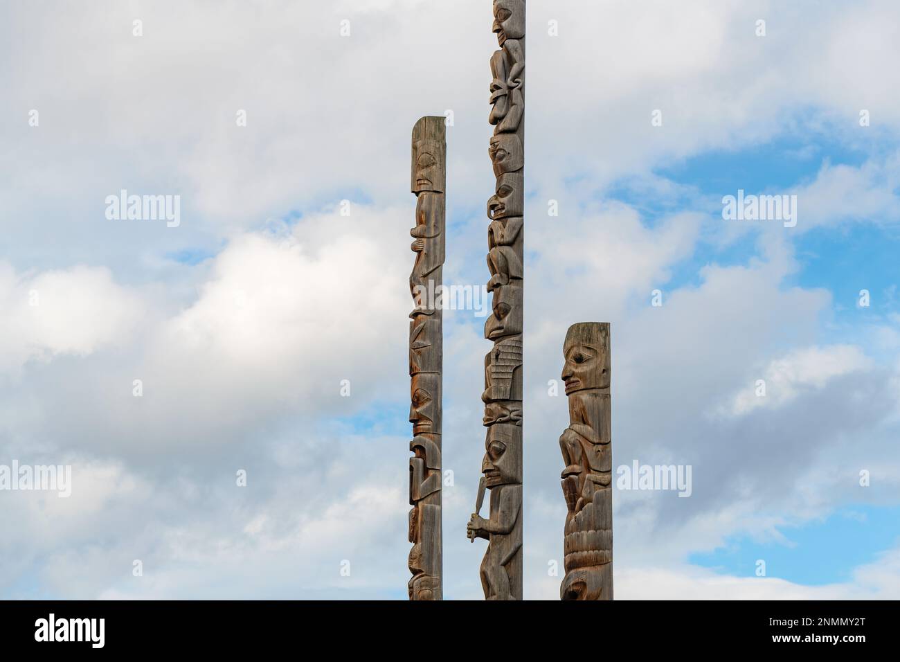 First nation totem poles of the Gitxsan natives in Gitanyow or Kitwancool, British Columbia, Canada. Stock Photo