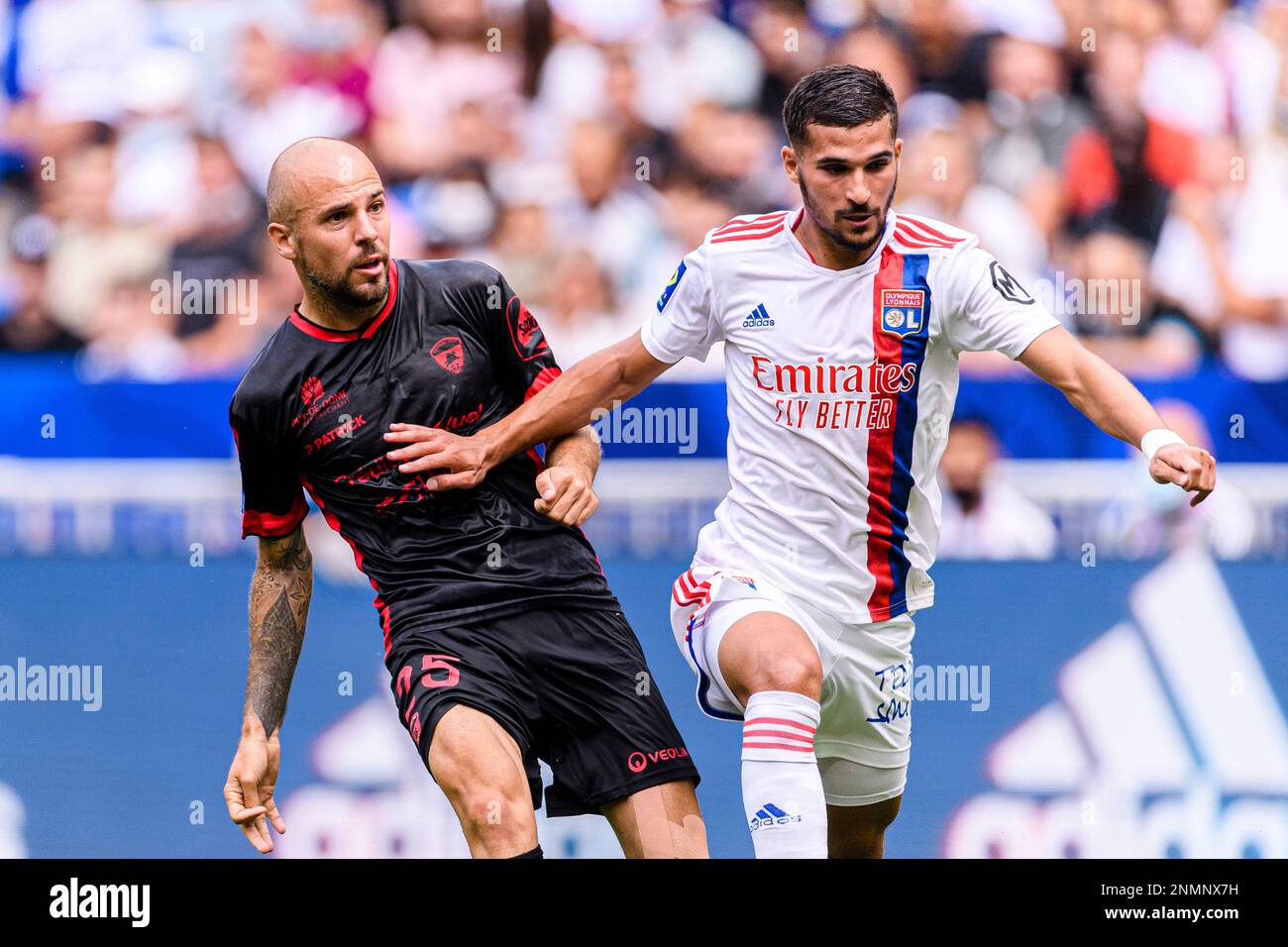 August 22, 2021, Lyon, France: Lyon, France - August 22: Johan Gastien of  Clermont Foot (L) plays against Houssem Aouar of Olympique Lyon (R) during  the Ligue 1 Uber Eats match between