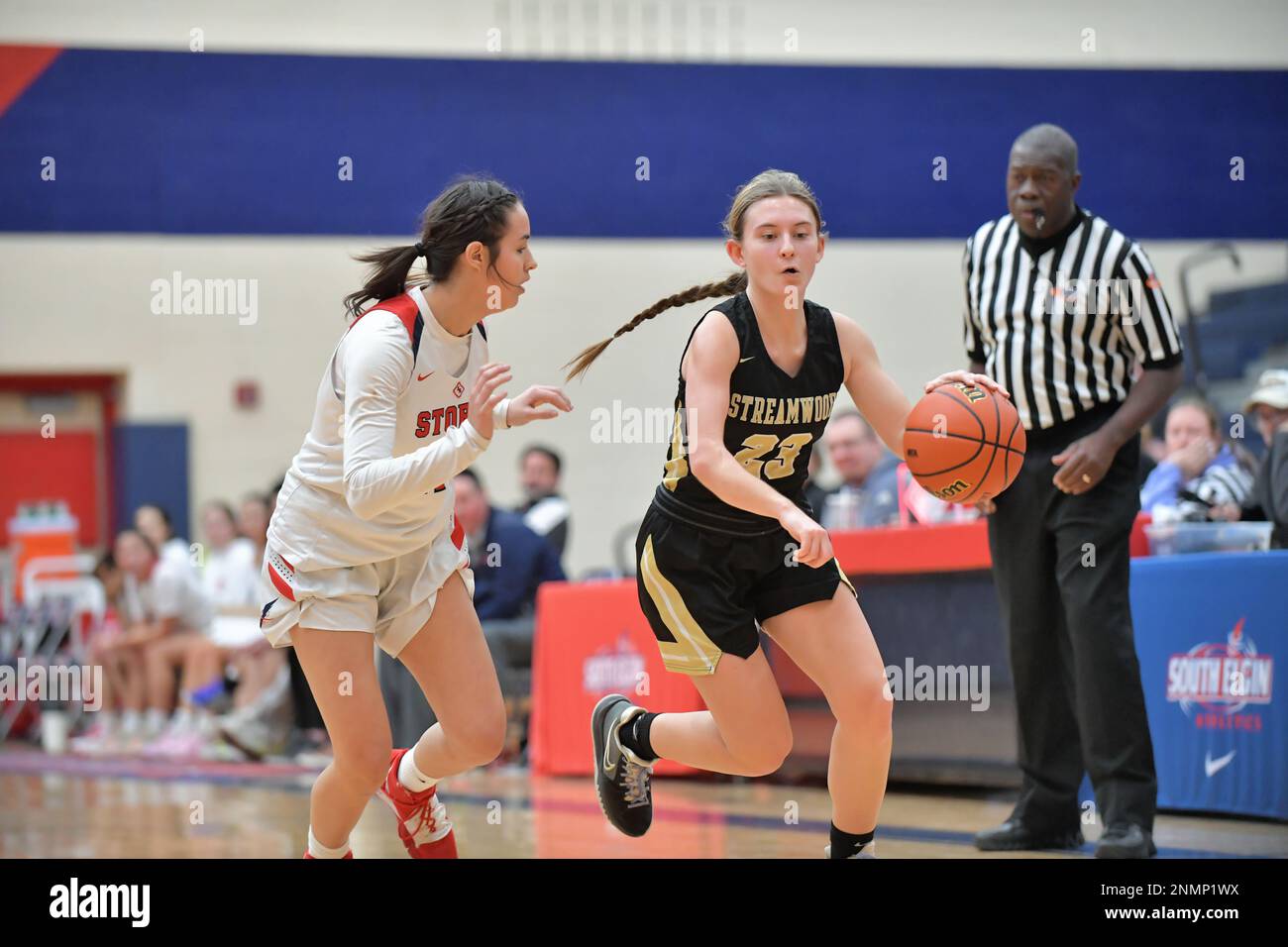 Player driving into the opposing zone while defended by an oppnent