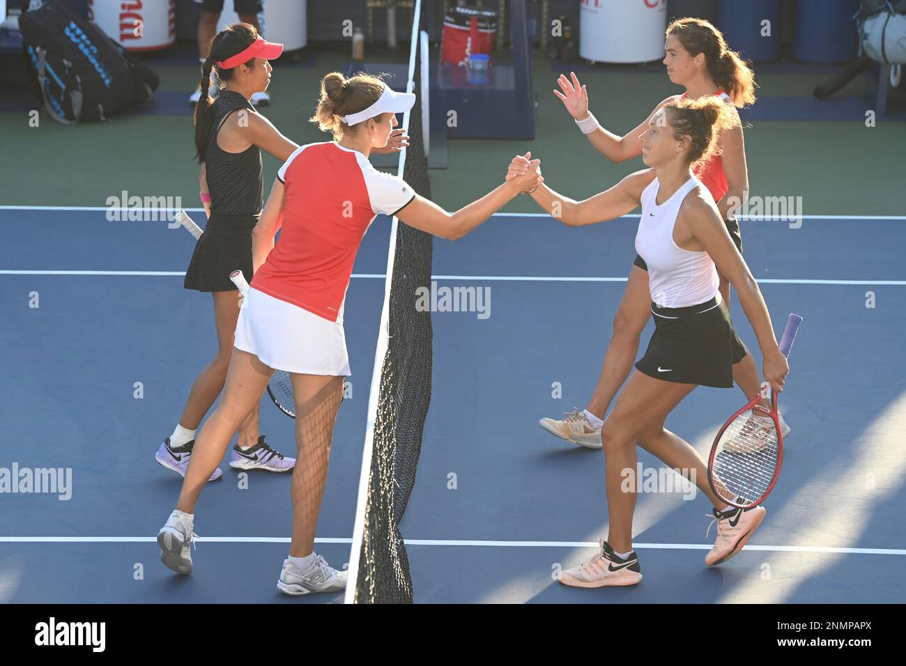 Su-Wei Hsieh and Elise Mertens high five Elixane Lechemia and Ulrikke