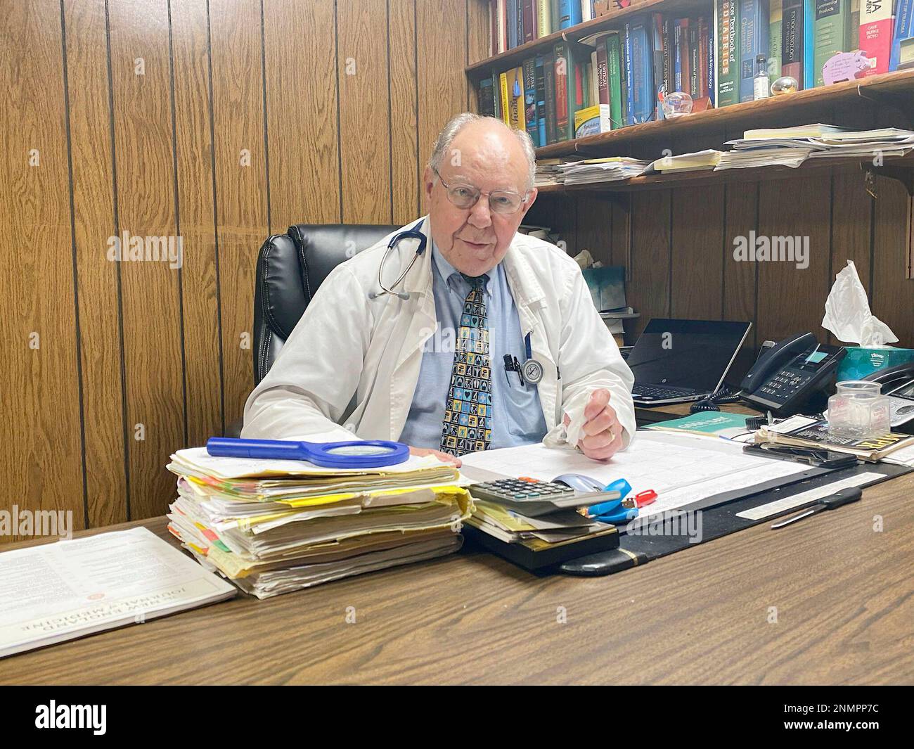Dr. Douglas Laflan sits at his desk, Aug 10, 2021 as he marked 50 years