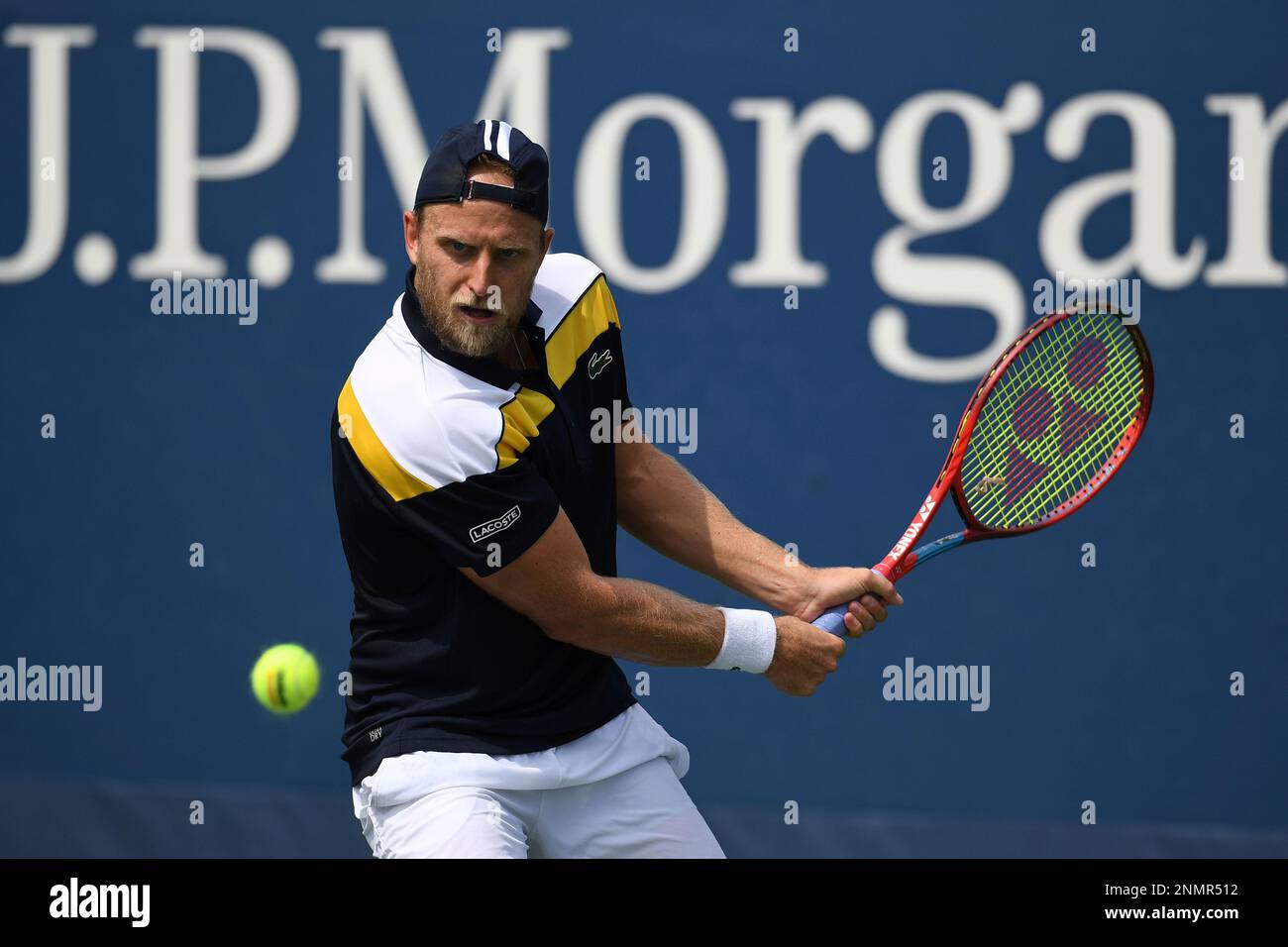 Denis Kudla eyes the tennis ball during a Mens Singles match at the 2021 US Open, Tuesday, Aug