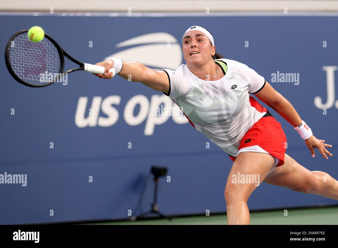 Ons Jabeur returns a shot to Alizé during a Women's Singles