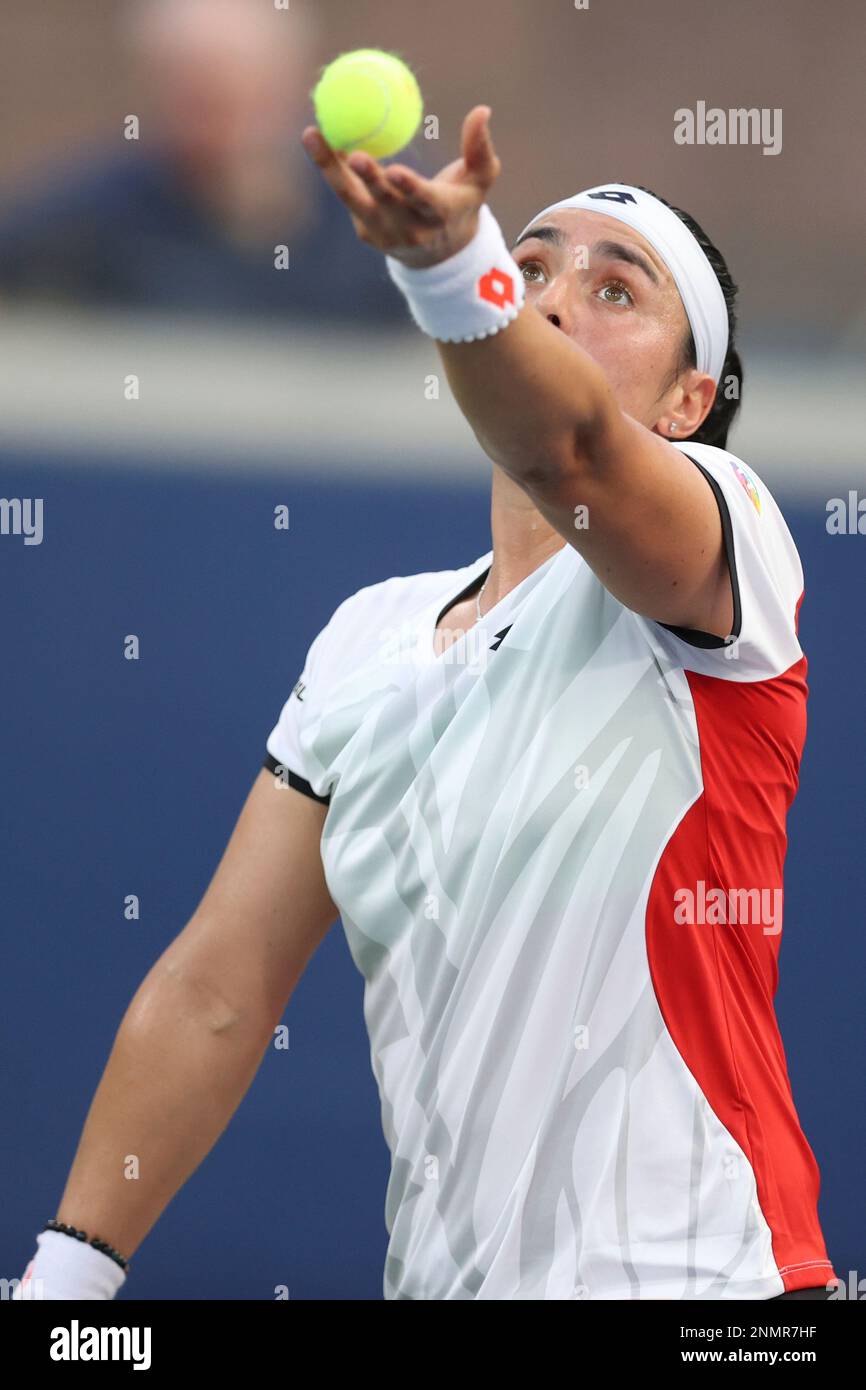 Ons Jabeur serves to Alizé during a Women's Singles match at the