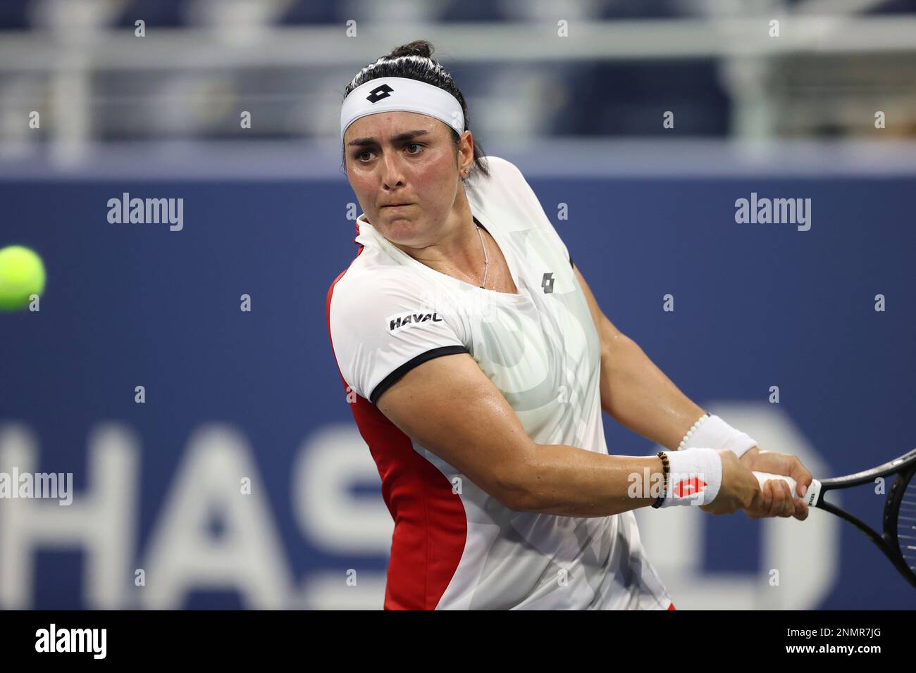 Ons Jabeur returns a shot to Alizé during a Women's Singles