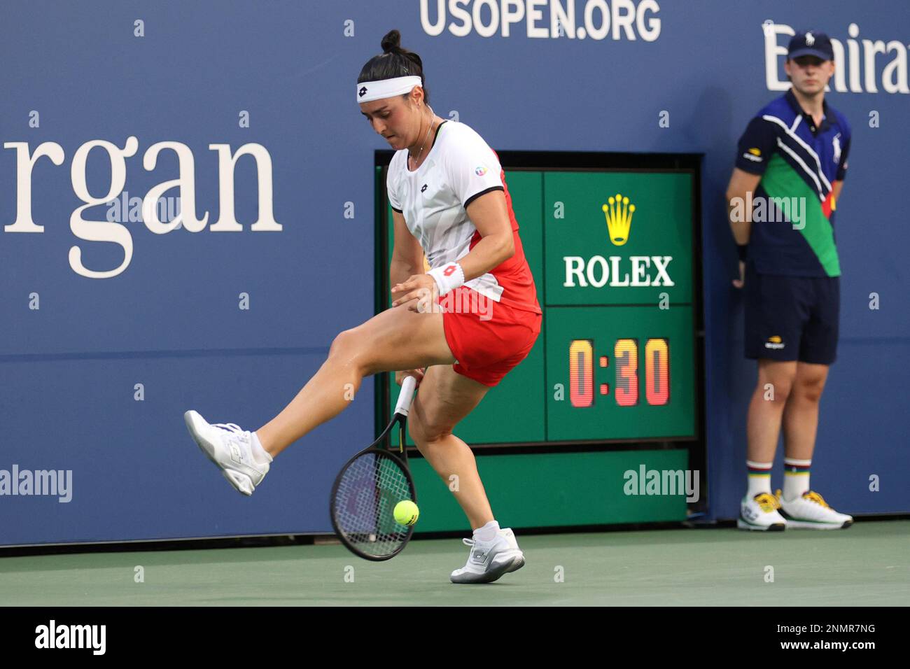 Ons Jabeur returns a shot to Alizé during a Women's Singles