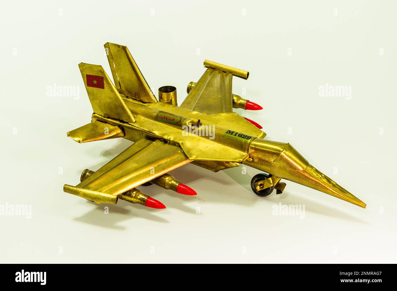 A Sukhoi SU-30 Flanker model plane made from old brass shell and bullet cases, a wartime souvenir from Vietnam Stock Photo