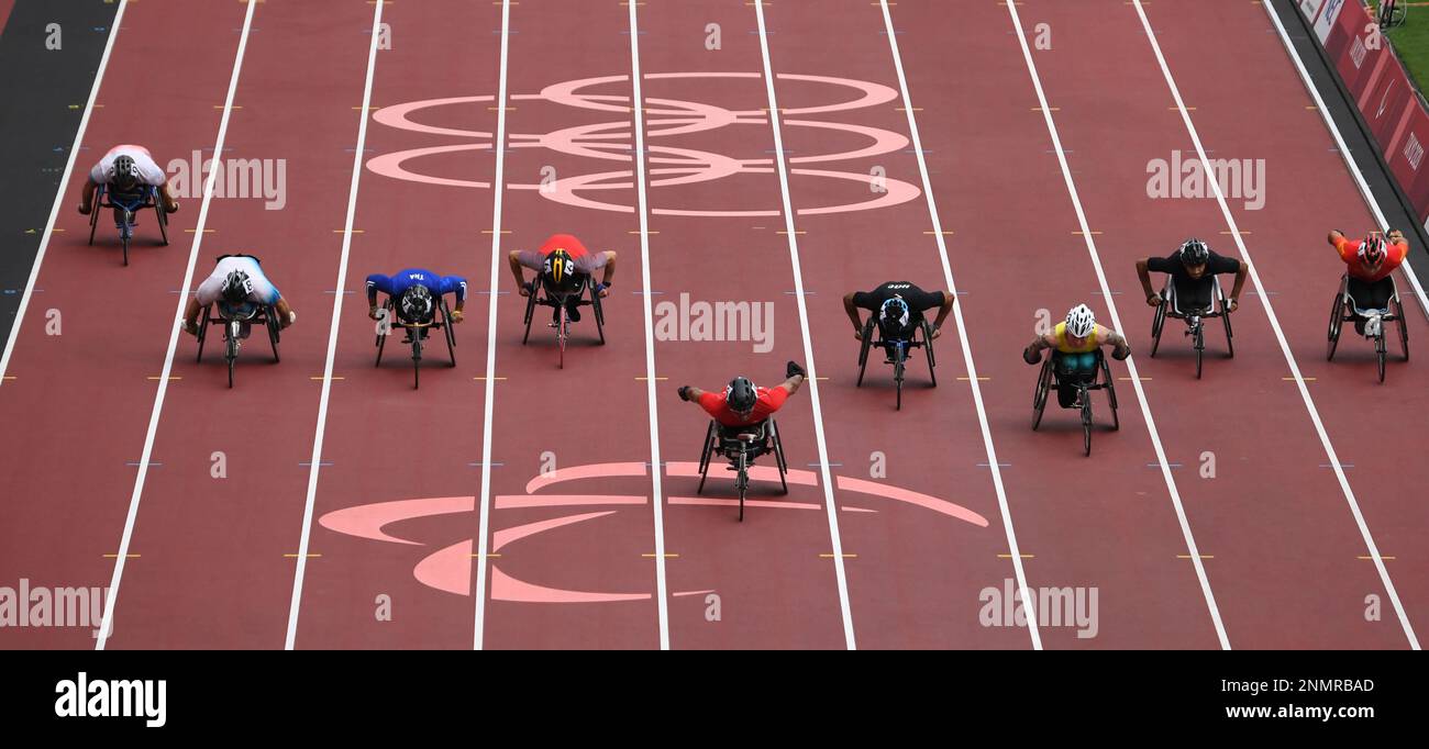 Tunisia's KTILA Walid (C)and other athletes compete in the Men's 100m