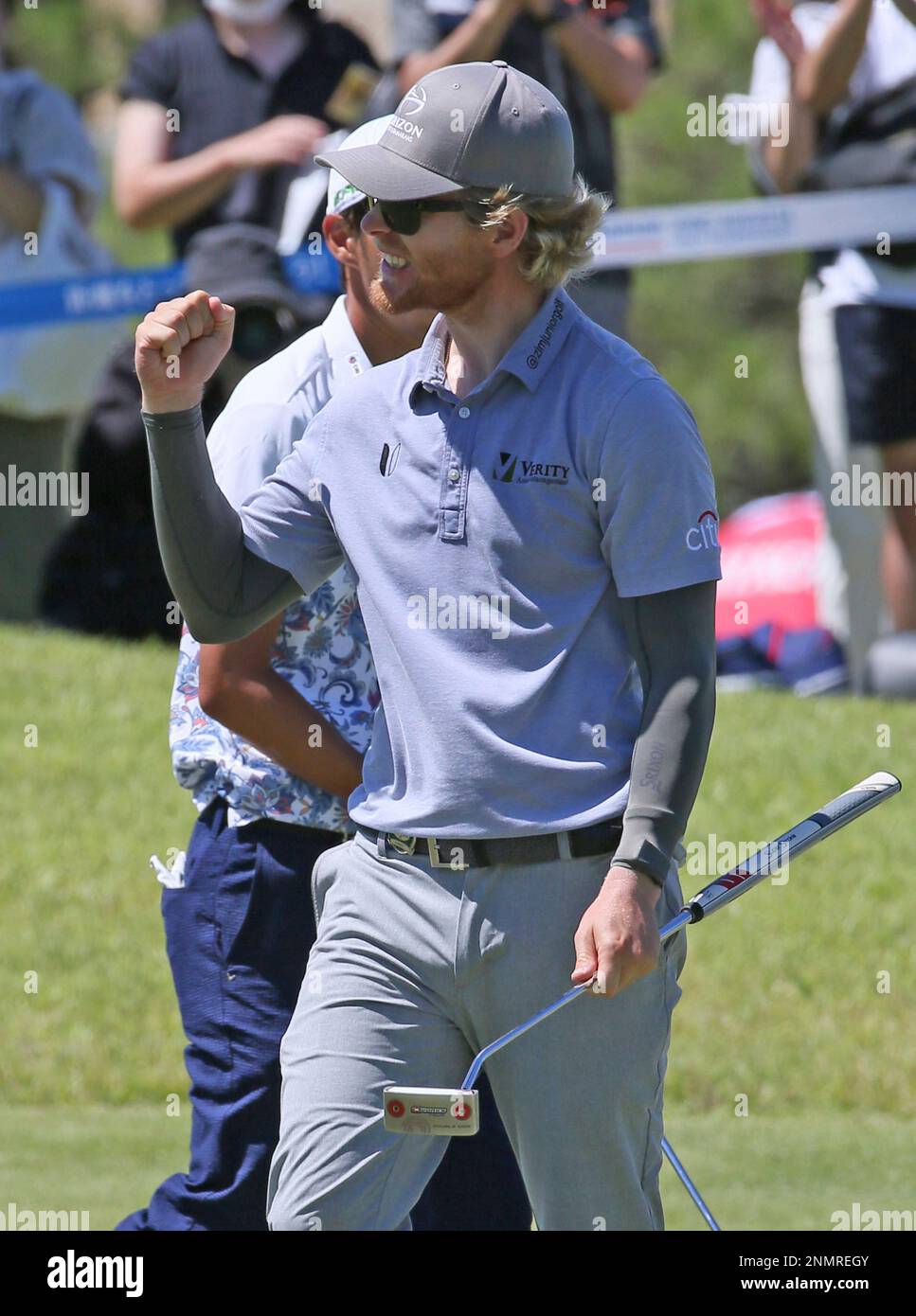 Scott Vincent of Zimbabw reacts after getting birdy during 9th