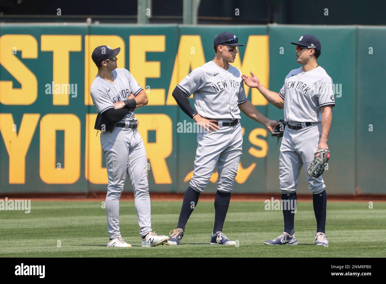 OAKLAND, CA - AUGUST 28: New York Yankees Outfielders Joey Gallo (13), Aaron  Judge (99), and Giancarlo Stanton (27) talks during the MLB game between  the New York Yankees and the Oakland