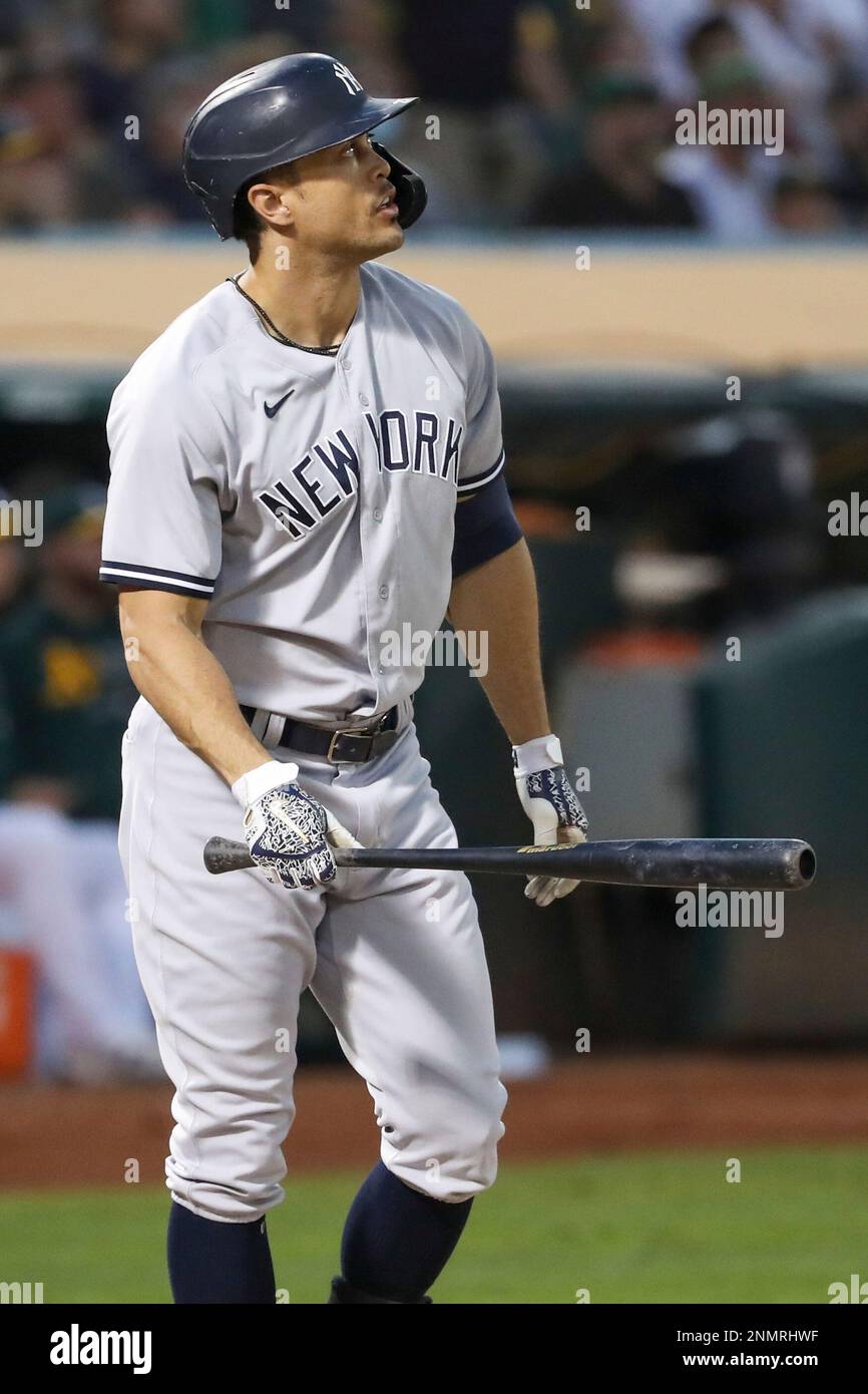 OAKLAND, CA - AUGUST 27: New York Yankees right fielder Giancarlo Stanton ( 27) watches his home run in the fourth inning of the MLB game between the  New York Yankees and the