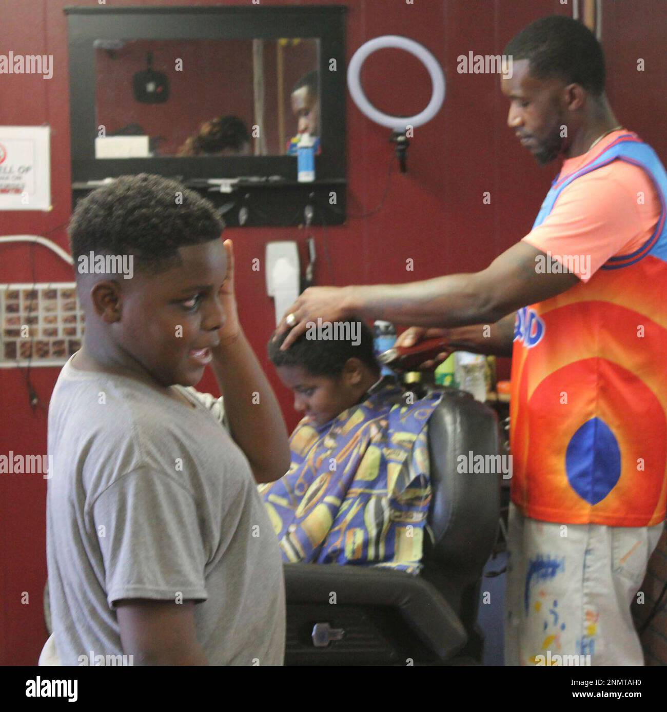 Barber Joey Walker, owner of Platinum Designs, offered free backto