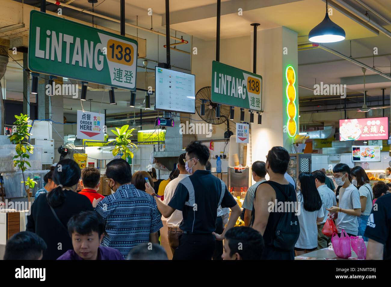 Chinese food vendors with queuing customers at the ICC Pudu Food Court, Kuala Lumpur, Malaysia Stock Photo