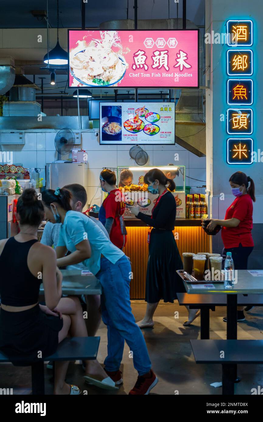 Chinese food vendors with customers at the ICC Pudu Food Court, Kuala Lumpur, Malaysia Stock Photo