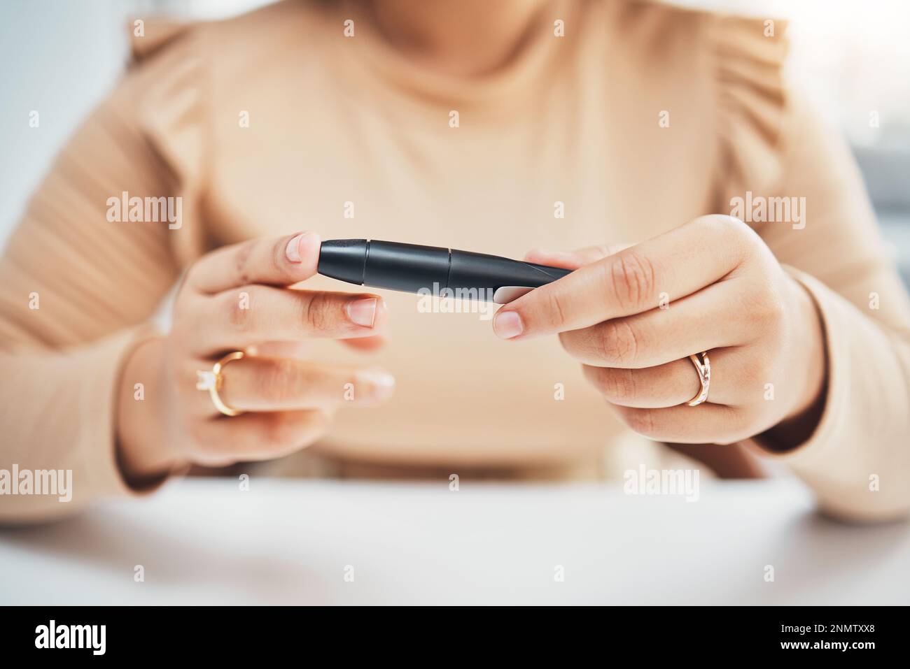 Diabetes, hands of black woman and blood test on finger, healthcare and