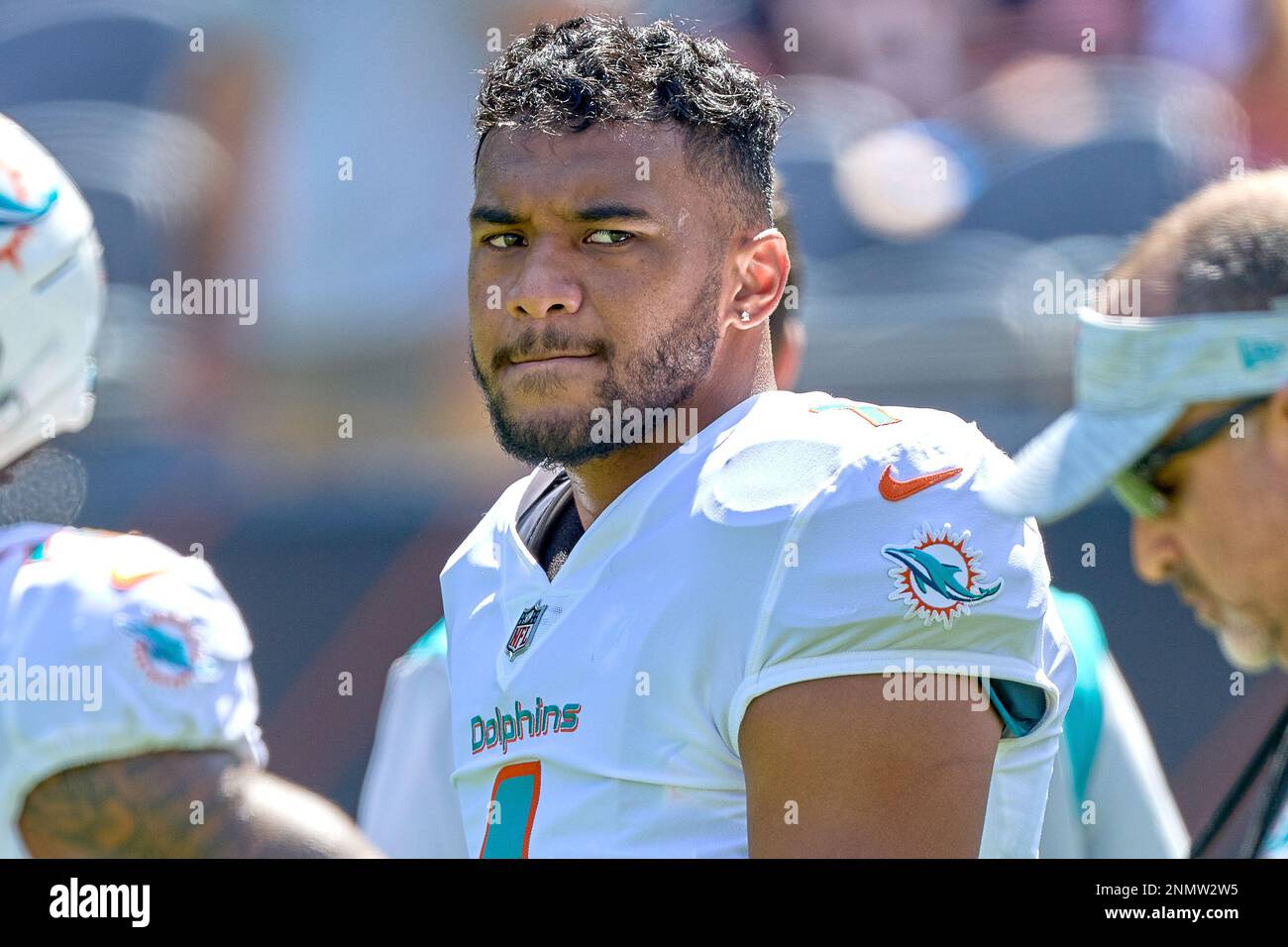 CHICAGO, IL - AUGUST 14: Miami Dolphins quarterback Tua Tagovailoa (1)  throws the football in warmups during a preseason game between the Chicago  Bears and the Miami Dolphins on August 14, 2021