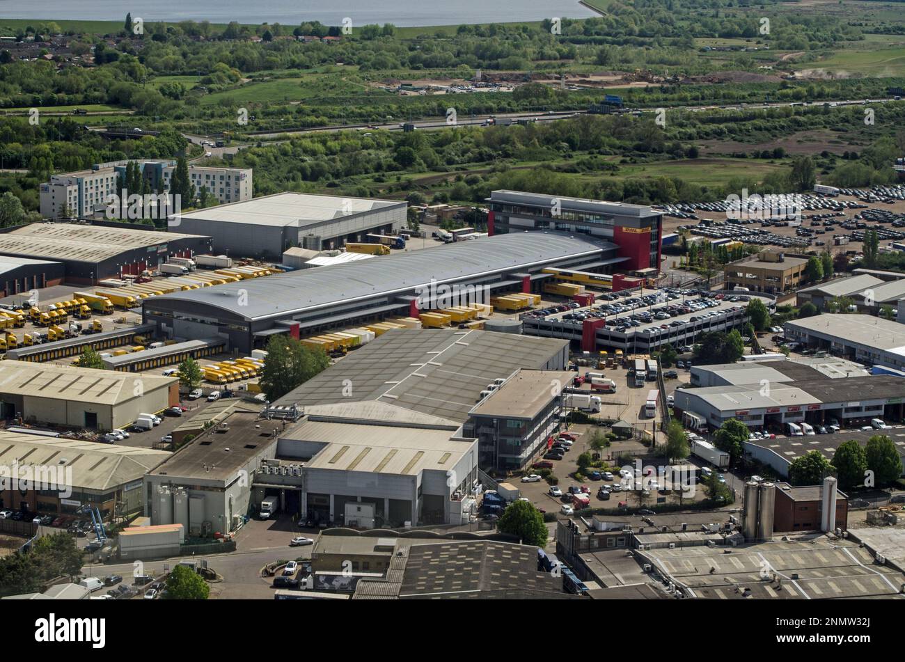 Slough, UK - April 26, 2022:  Aerial view of an industrial estate in Colnbrook, Slough which includes the Southern Hub of DHL Express. The warehouses Stock Photo