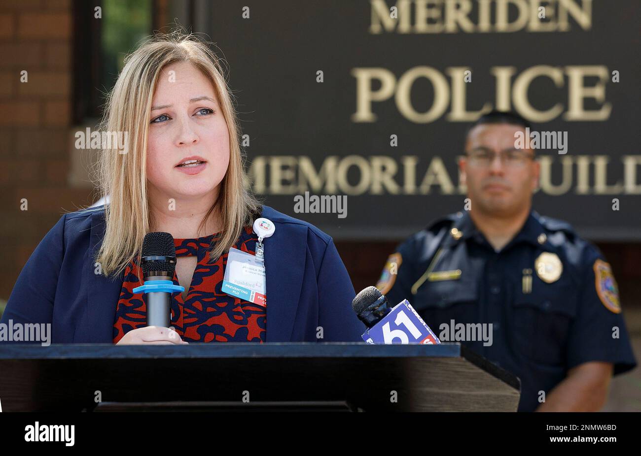 Jessica Matyka, Rushford clinical director, speaks next to Police Chief