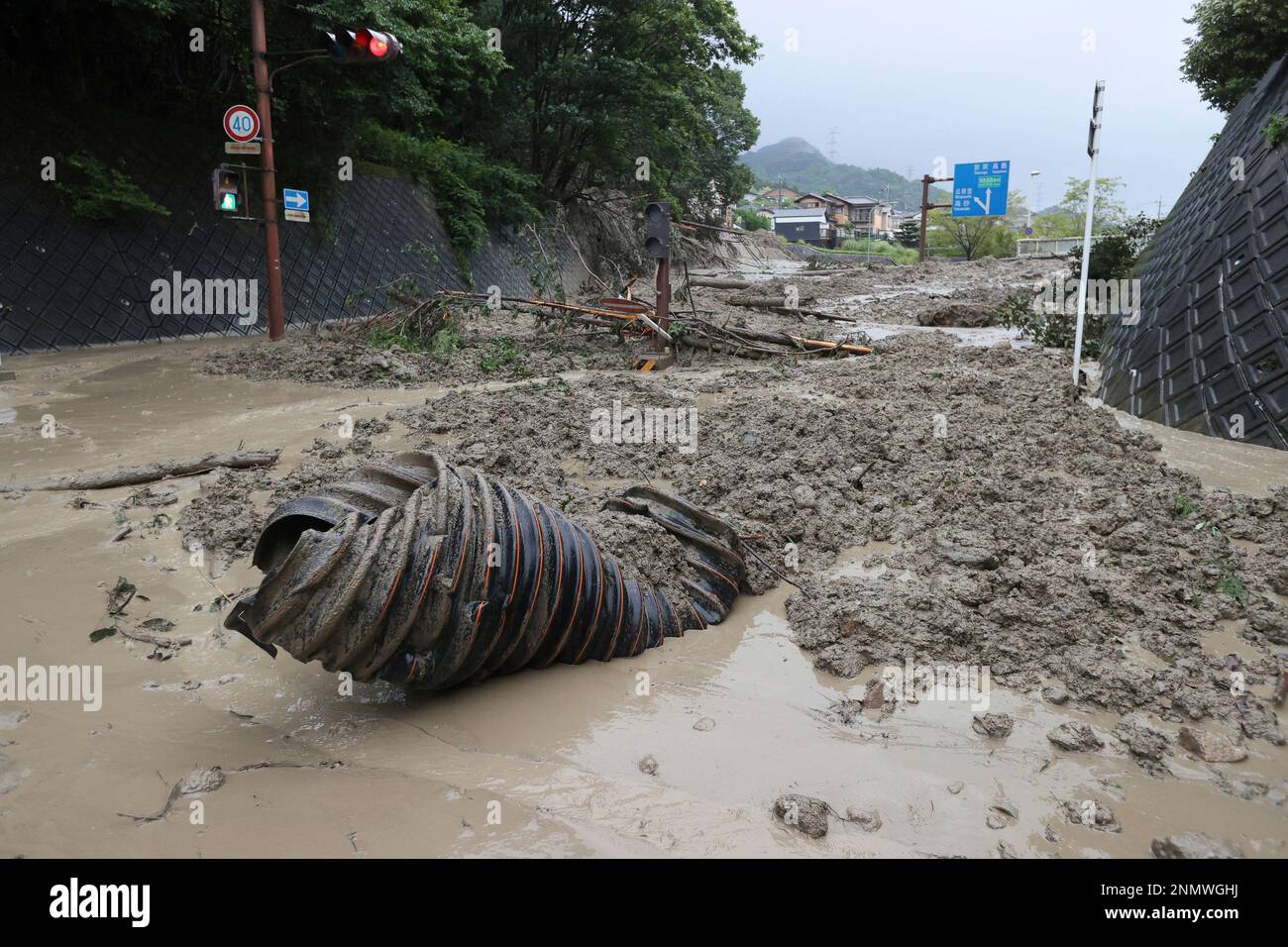 A landslide triggered by a torrential rain covers a road in Otsu, Shiga