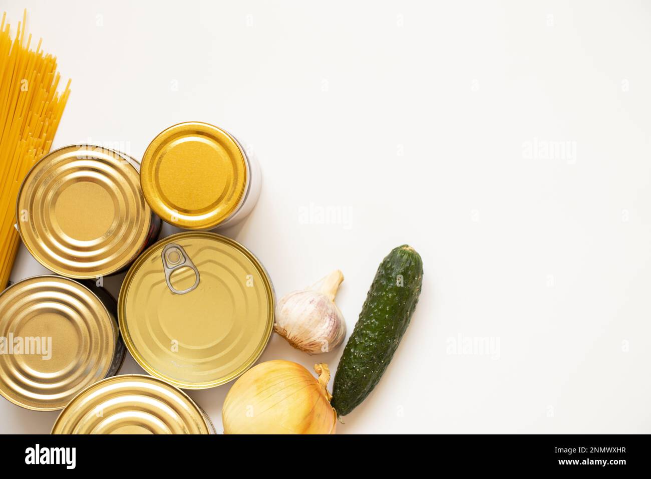 Canned food different, spaghetti and onion, cucumber and garlic on a white background, a set of