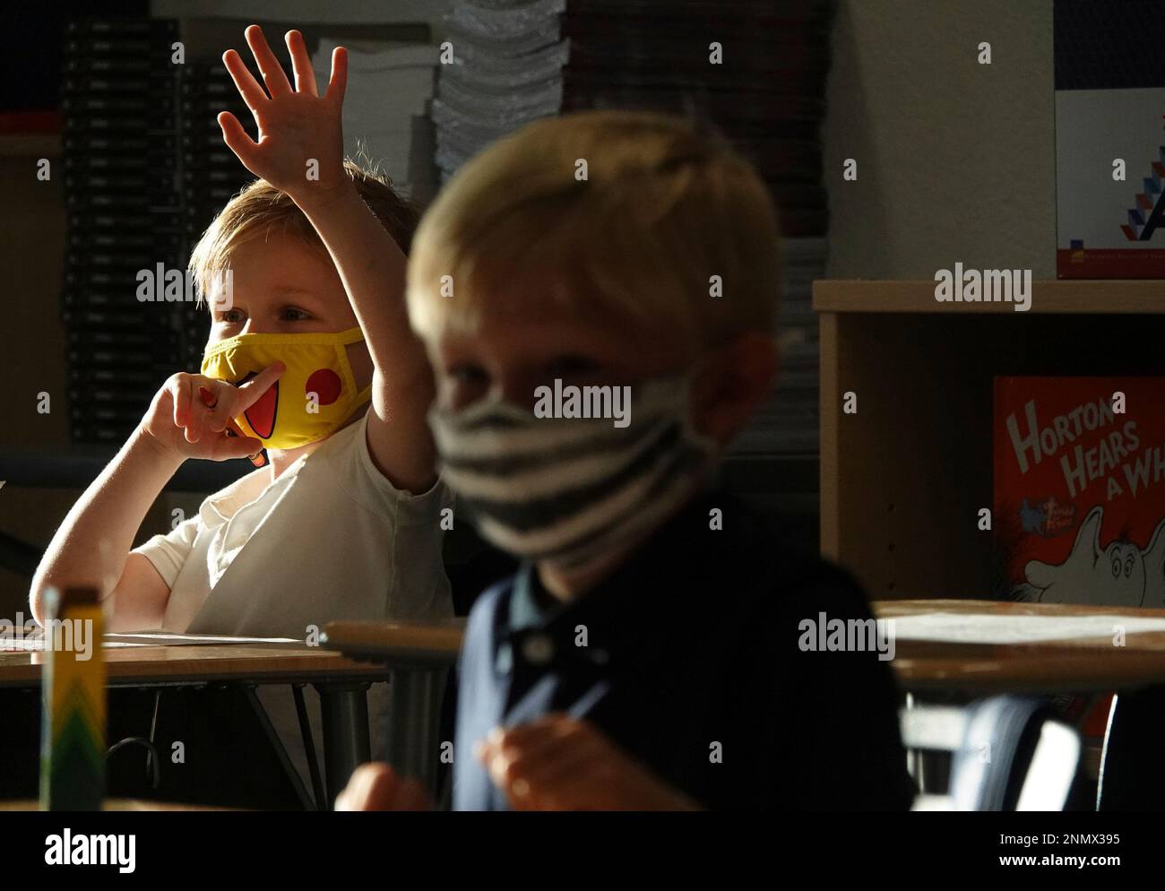 First Graders Alex Albin, left, and Tyler Custodio wear masks in Amanda